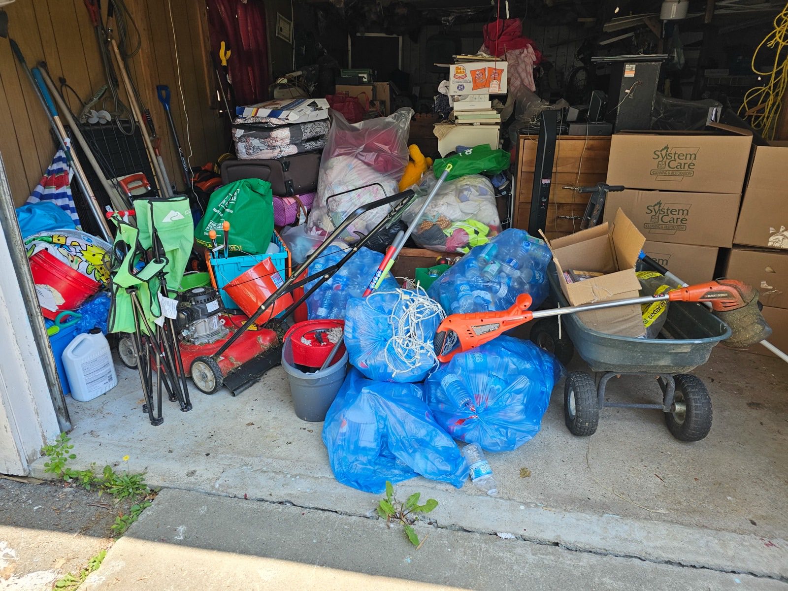 Cluttered garage being cleared for a fresh start